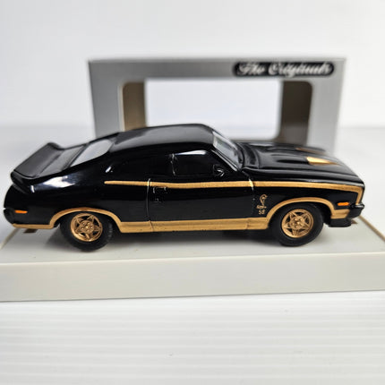 Side view of Trax TR10C Ford XC Falcon GS Hardtop with black and gold Cobra graphics 2