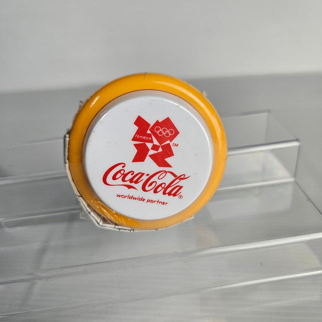 Official Coca-Cola London 2012 Olympic Games promotional yellow yo-yo factory sealed in original packaging with London 2012 logo and Coca-Cola Worldwide Partner branding.