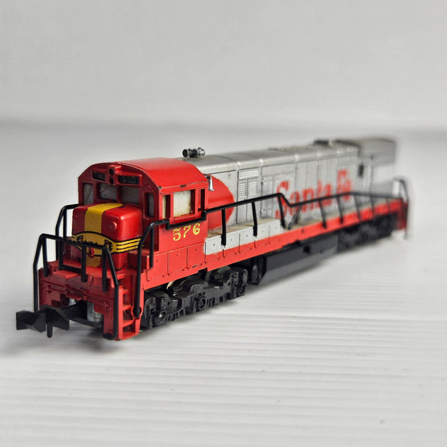 Minitrix N Scale Santa Fe U28C diesel locomotive No. 576 in red and silver ATSF freight livery for model railway layouts and collectors.