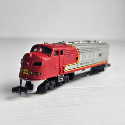 Bachmann N Scale Santa Fe F7A diesel locomotive No. 215 in classic ATSF Warbonnet red and silver livery for model railway layouts and collectors.