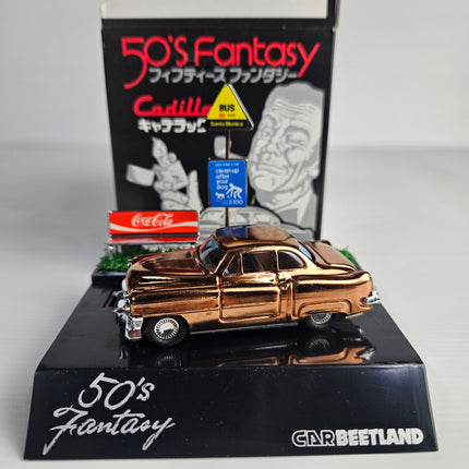 Car Beetland 50's Fantasy metallic gold Cadillac 1:70 scale display model with scenic base and original Japanese presentation box.