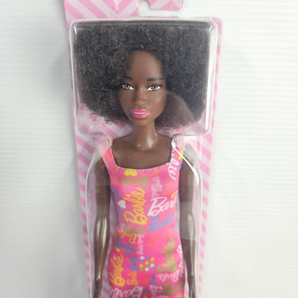 Barbie HGM58 doll face and pink logo-print dress close-up