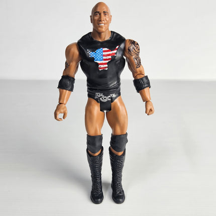 Front view of pre-owned WWE The Rock 2017 Mattel articulated action figure wearing black ring gear and Brahma Bull logo shirt.