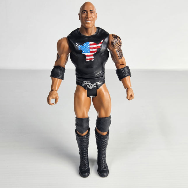 Front view of pre-owned WWE The Rock 2017 Mattel articulated action figure wearing black ring gear and Brahma Bull logo shirt.