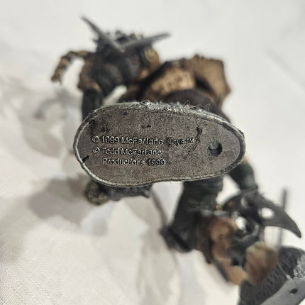 1999 McFarlane Toys copyright marking on Tormentor action figure foot