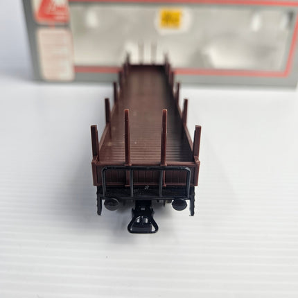End view of Lima 309042 DB HO scale stake wagon with coupling and upright stakes. 2