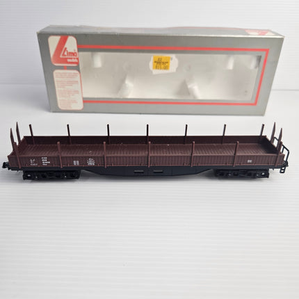 Side view of Lima 309042 DB brown four-axle stake wagon.