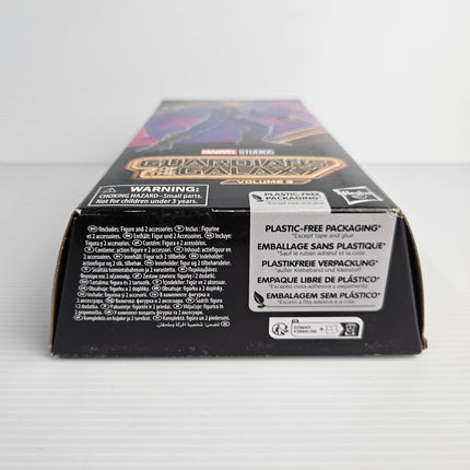 Bottom of Star-Lord F6602 plastic-free packaging showing the figure and two accessories statement