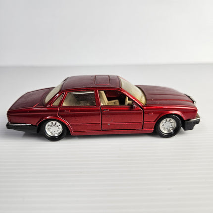 Side view of Matchbox SuperKings K-146 metallic red Jaguar XJ6 XJ40 diecast model