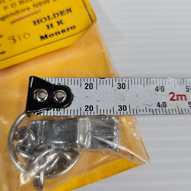 Rosco’s Holden HK Monaro pewter key ring shown beside a measuring tape