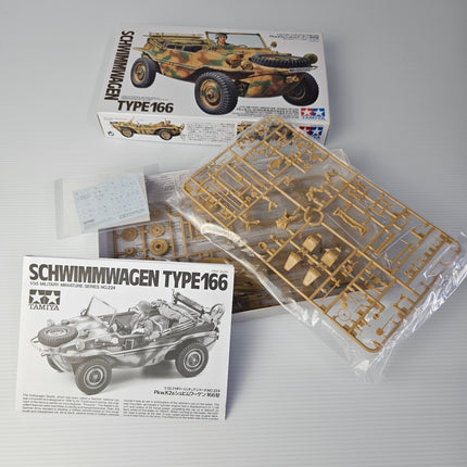 Open Tamiya Schwimmwagen Type 166 kit showing complete contents