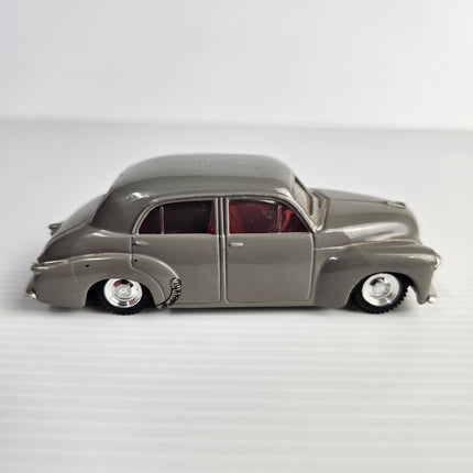 Side profile of Trax 8001 dark grey Holden FJ Sedan with red interior
