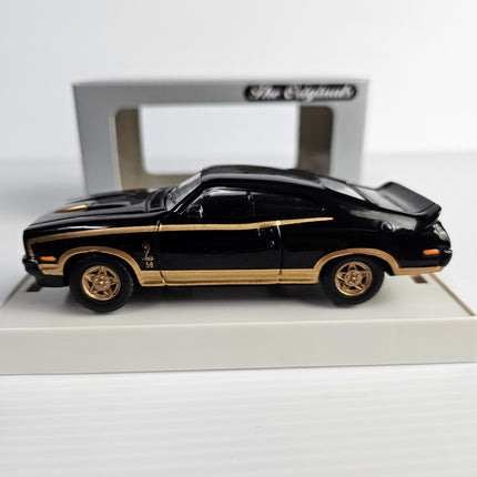Side view of Trax TR10C Ford XC Falcon GS Hardtop with black and gold Cobra graphics
