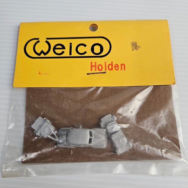 Close-up of Weico Holden FX Sedan N-scale white-metal body and kit components