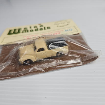 Side view of cream Weico Models F.J. Holden Ute with black tonneau cover in 1:87 HO scale